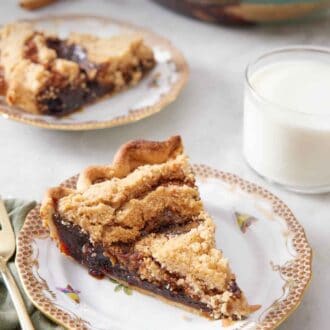 Pinterest graphic of a plate with a slice of shoofly pie with a glass of milk, another plated serving, and the rest of the pie in the background.