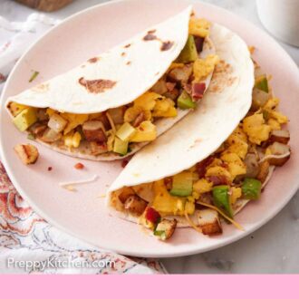 Pinterest graphic of a plate with two breakfast tacos.