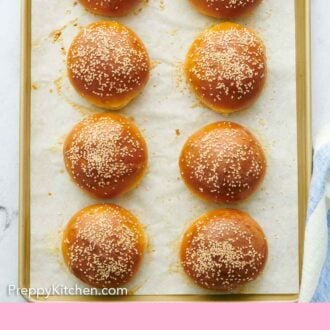 Pinterest graphic of an overhead view of a sheet pan with burger buns.