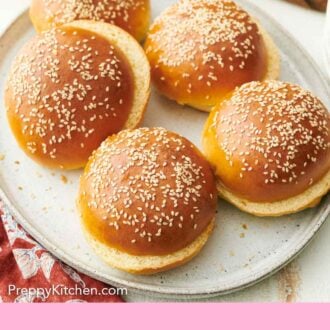 Pinterest graphic of homemade burger buns on an oval platter.