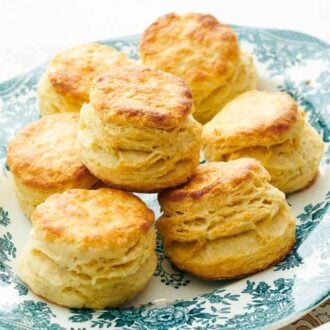 A pile of buttermilk biscuits on a platter.