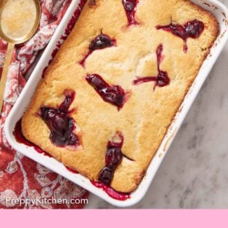 Pinterest graphic of an overhead view of a baking dish of cherry cobbler with a bowl of cherries on the side.