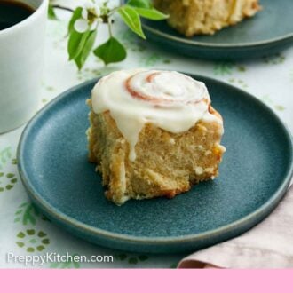 Pinterest graphic of two plates with cinnamon rolls, one plate in front of the other.