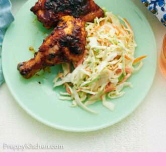 Pinterest graphic of an overhead view of a plate of grilled chicken and coleslaw.