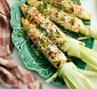 Pinterest graphic of a lettuce-shape platter of elote with a plate of limes on the side.