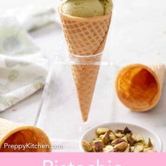 Pinterest graphic of an ice cream cone with two scoops of pistachio ice cream. A bowl of pistachios in front with two cones scattered.