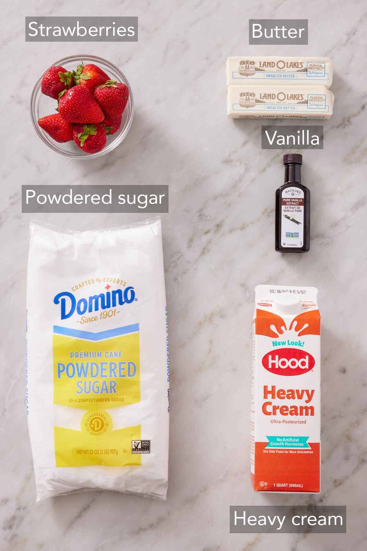 Ingredients needed to make strawberry frosting.