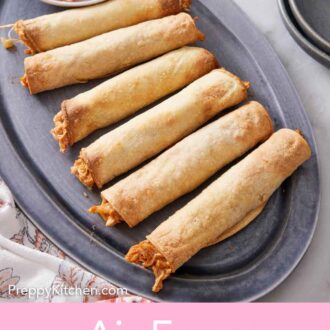 Pinterest graphic of a platter of six air fryer taquitos with a bowl of salsa.