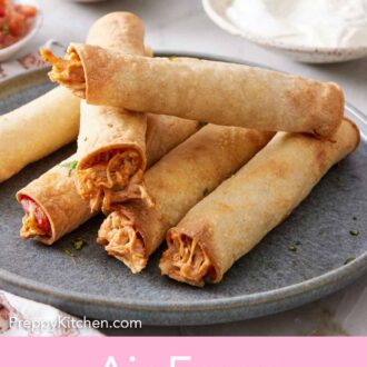 Pinterest graphic of a plate of a pile of air fryer taquitos. Sour cream, guacamole, and plates in the background.