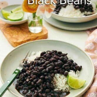 Pinterest graphic of two plates of Instant Pot black beans over rice with a lime wedge.