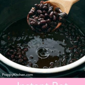 Pinterest graphic of black beans inside of an Instant Pot with a wooden spoon scooping up a spoonful.