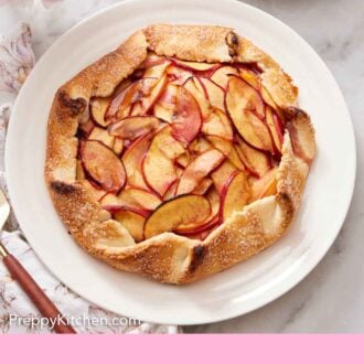 Pinterest graphic of a white platter with a peach galette.