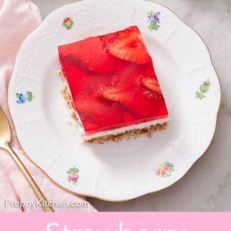 Pinterest graphic of a plate with a square piece of strawberry pretzel salad.