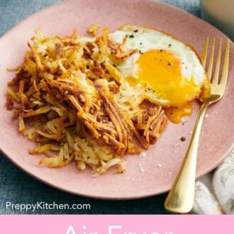 Pinterest graphic of a plate of air fryer hash browns with a fried egg and a fork.