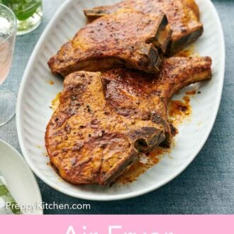 Pinterest graphic of a platter with four air fryer pork chops.