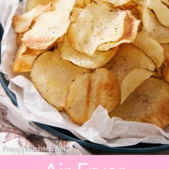 Pinterest graphic of a close up view of a pile of air fryer potato chips topped with some pepper in a parchment lined plate.