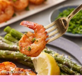 Pinterest graphic of a fork holding up an air fryer shrimp from a plate.