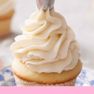 Pinterest graphic of a coconut frosting piped onto a cupcake.