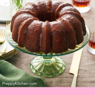 Pinterest graphic of a green cake stand with a rum cake on top.