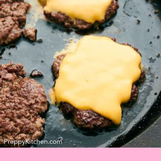 Pinterest graphic of smash burger patties on a cast iron grill, two patties with sliced cheddar cheese on top.