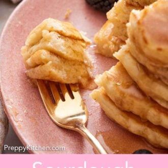 Pinterest graphic of a fork with cut sourdough pancake on it on a pink plate with a stack of pancakes.