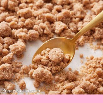 Pinterest graphic of a spoon spooning some streusel topping from a sheet pan.