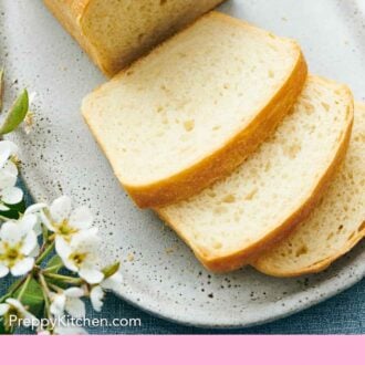 Pinterest graphic of a slightly overhead view of a loaf of white bread with three slices cut in front.