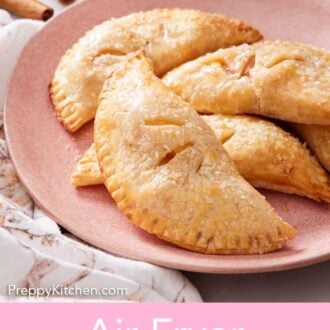 Pinterest graphic of a pink plate with multiple air fryer hand pies.