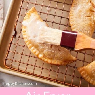 Pinterest graphic of glaze brushed over an air fryer hand pie on a cooling rack.