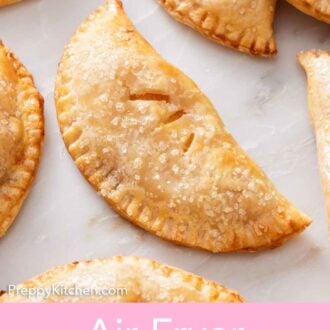 Pinterest graphic of an overhead view of air fryer hand pies on a marble surface.