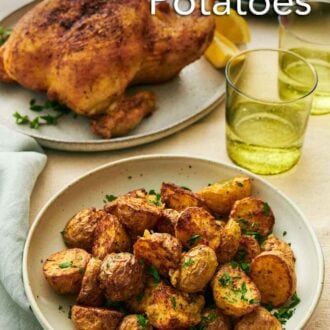 Pinterest graphic of a plate with air fryer potatoes with two drinks in the back along with a whole roast chicken.