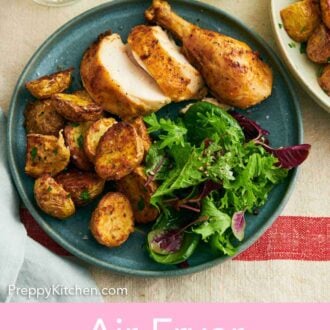 Pinterest graphic of a plate of air fryer potatoes, salad, and chicken.