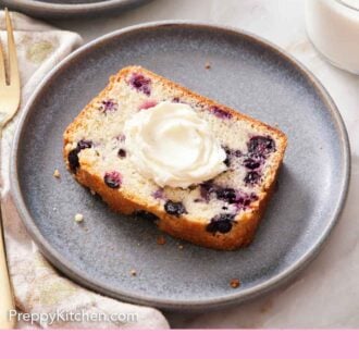 Pinterest graphic of a plate with sliced blueberry bread with frosting.