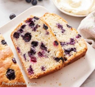 Pinterest graphic of two slices of blueberry bread sliced off the loaf on a platter. Blueberries and a bowl of frosting in the back.