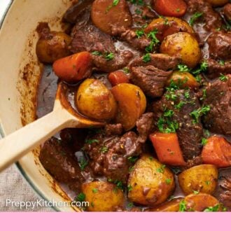 Pinterest graphic of a spoon tucked into lamb stew in a pot.