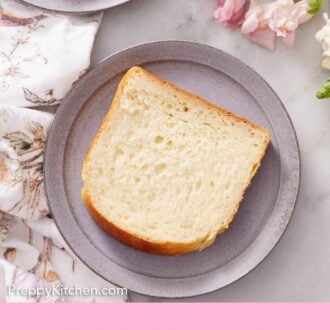 Pinterest graphic of overhead view of a plate with a slice of milk bread. Another plate off to the side.