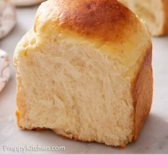 Pinterest graphic of a piece of milk bread cut and standing upright.