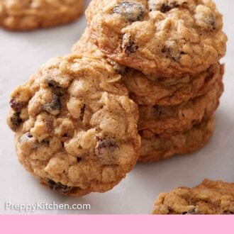 Pinterest graphic of a stack of four oatmeal cookies with one leaning beside it.