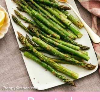 Pinterest graphic of a platter of roasted asparagus with a serving fork.