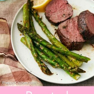 Pinterest graphic of a plate with oven roasted asparagus, steak, and a lemon wedge.