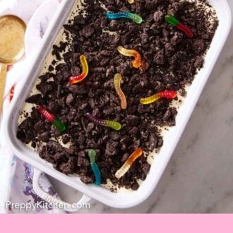 Pinterest graphic of an overhead view of dirt cake in a white baking dish.