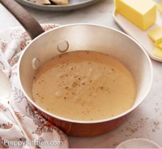 Pinterest graphic of a saucepan of gravy topped pepper. Some butter, turkey, and mashed potatoes in the background.