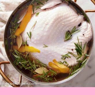 Pinterest graphic of a pot with a raw turkey submerged in turkey brine.