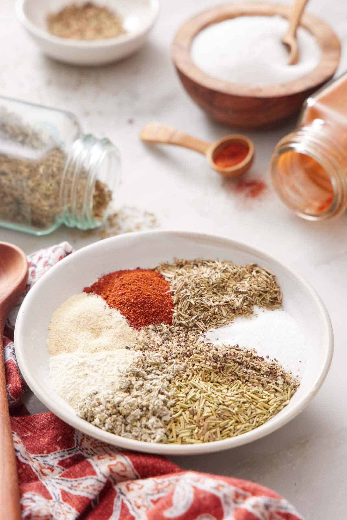 A bowl showing all the seasoning for turkey seasoning, before being stirred.