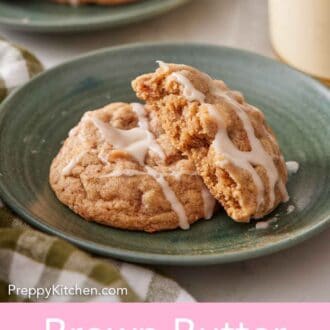 Pinterest graphic of a plate with a brown butter wassail cookie with a half cookie leaning on top.