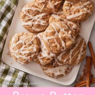 Pinterest graphic of a platter of brown butter wassail cookies with icing drizzled on top.