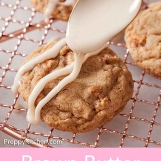 Pinterest graphic of icing spooned over a brown butter wassail cookie on a cooling rack.