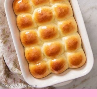 Pinterest graphic of a white baking dish full of dinner rolls.