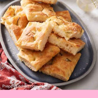 Pinterest graphic of a platter with pieces of focaccia.