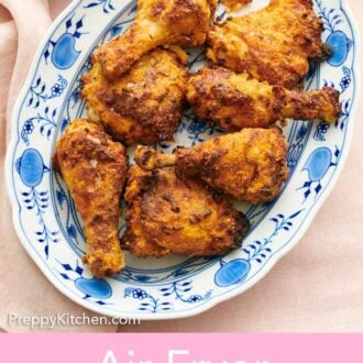 Pinterest graphic of an overhead view of a platter of air fryer fried chicken.